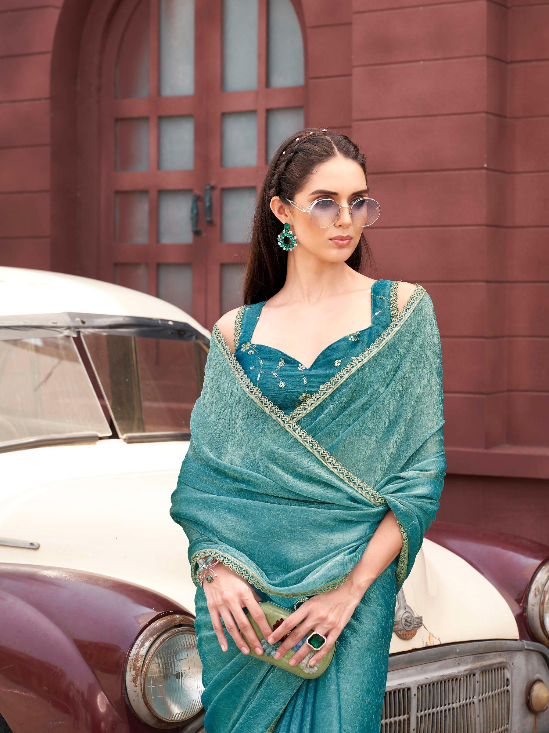 Two toned blue and gold colored wrinkled saree with embroidered blouse and embellished lace